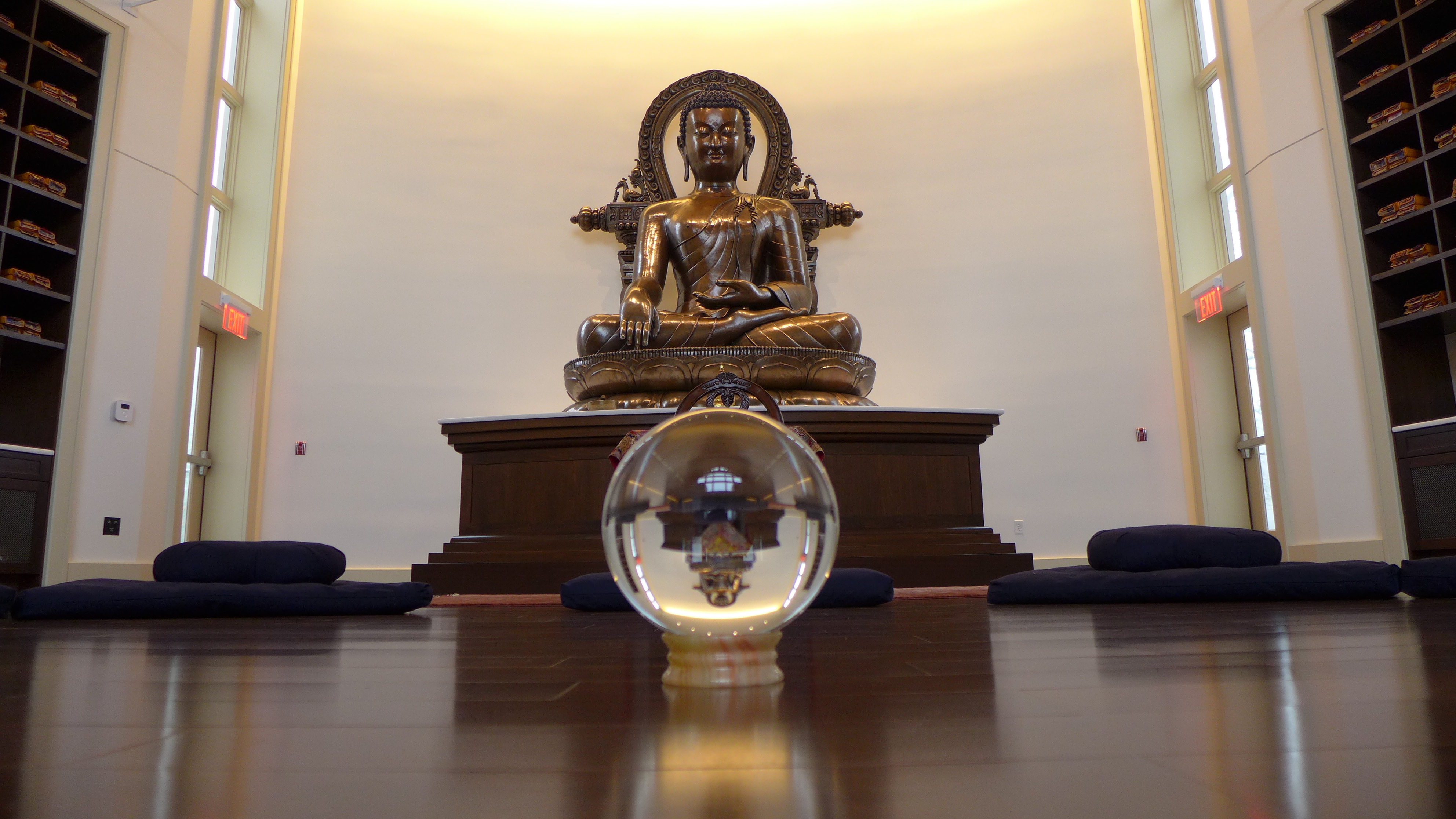 Meditation cushions, the large copper Buddha and a crystal ball for meditation