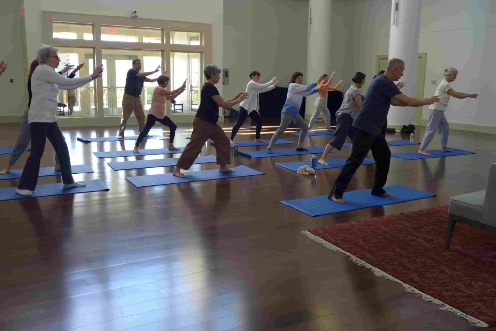 A group of people practice QiGong