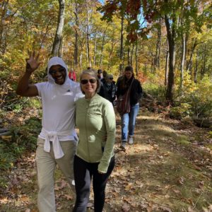 couples walking through the woods