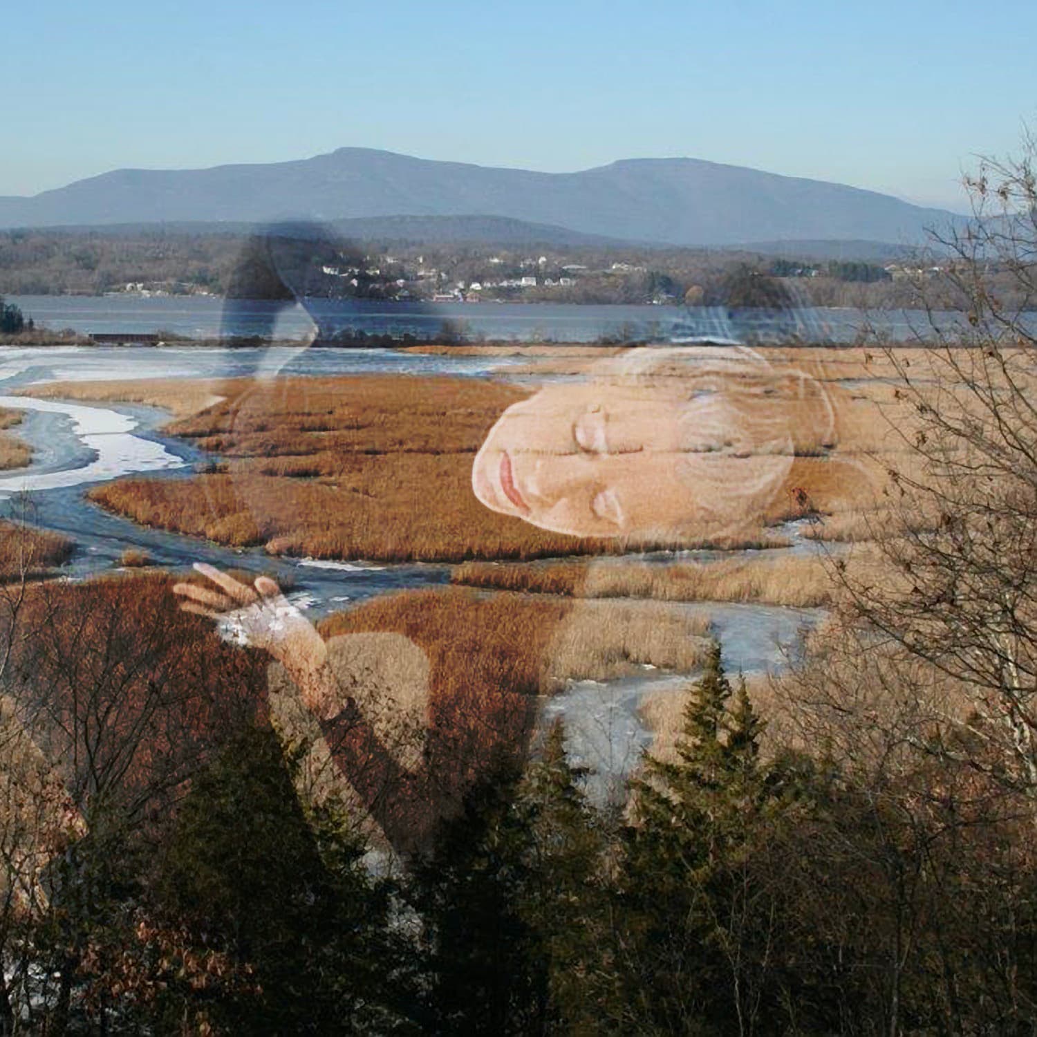 A woman with wetlands behind her