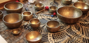 Tibetan singing bowls arrayed on a rug