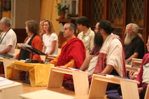 People sitting at Buddhist meditation tables