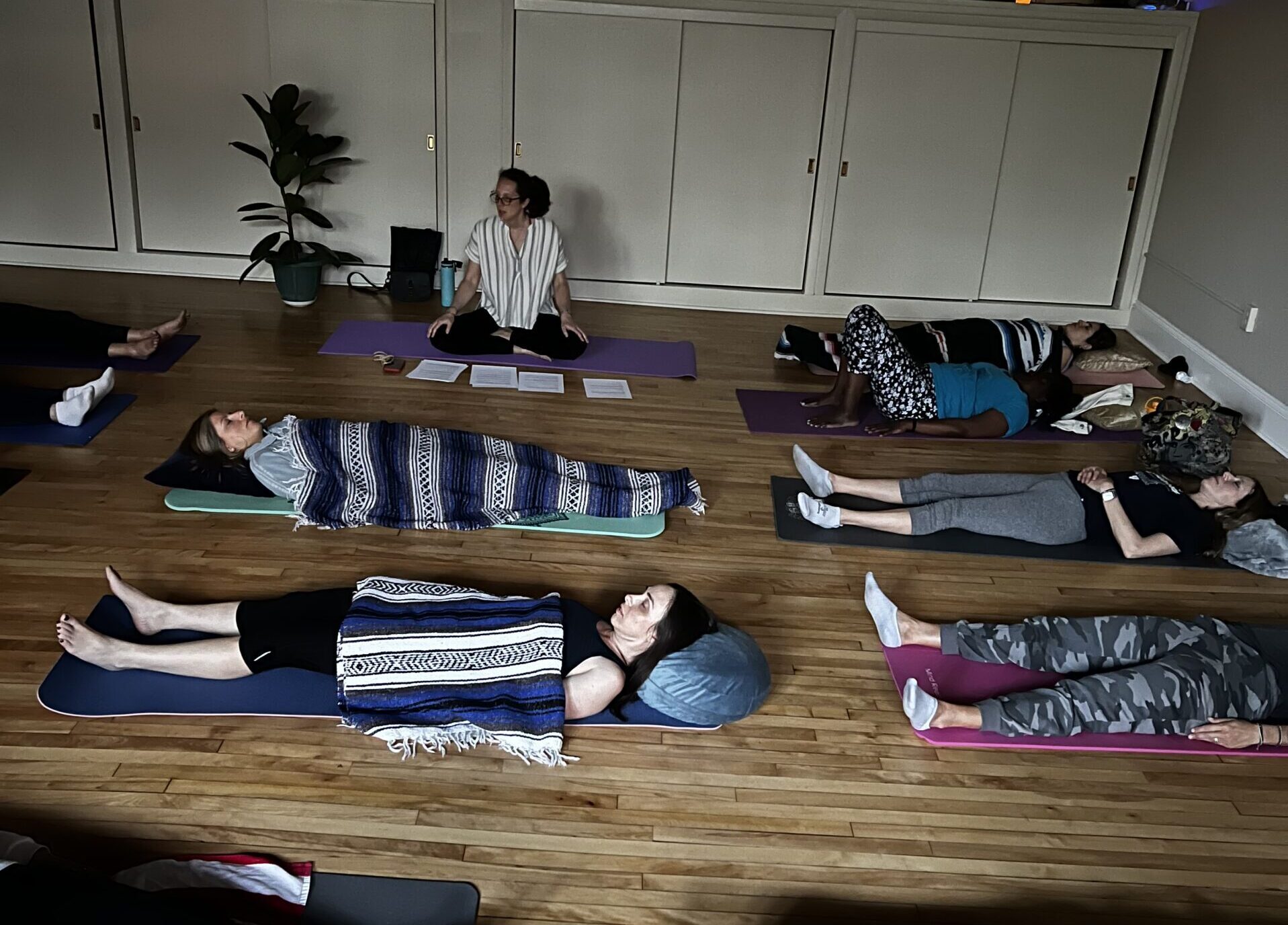 Miranda Lee oversees shavasana